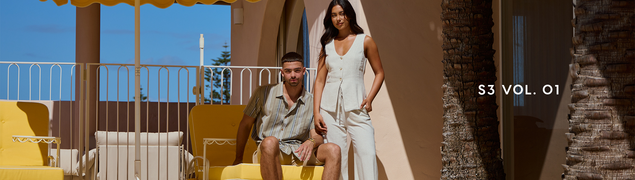S3 Vol. 3 Lookbook. Image shows a woman and a man posing in a garden wearing City Beach fashion clothing